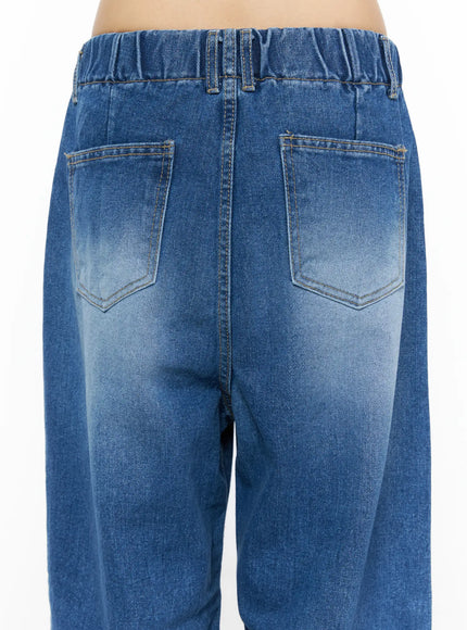 Easton Washed Wide Leg Jeans CU530 Dark blue close-up back detail showing elasticated waistband, dual back pockets with gold topstitching, and faded wash denim texture