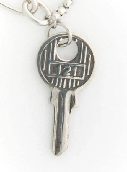 LEWKIN Eden Key Necklace IL522 Silver close-up detail of engraved key pendant with number 121 and box chain attachment