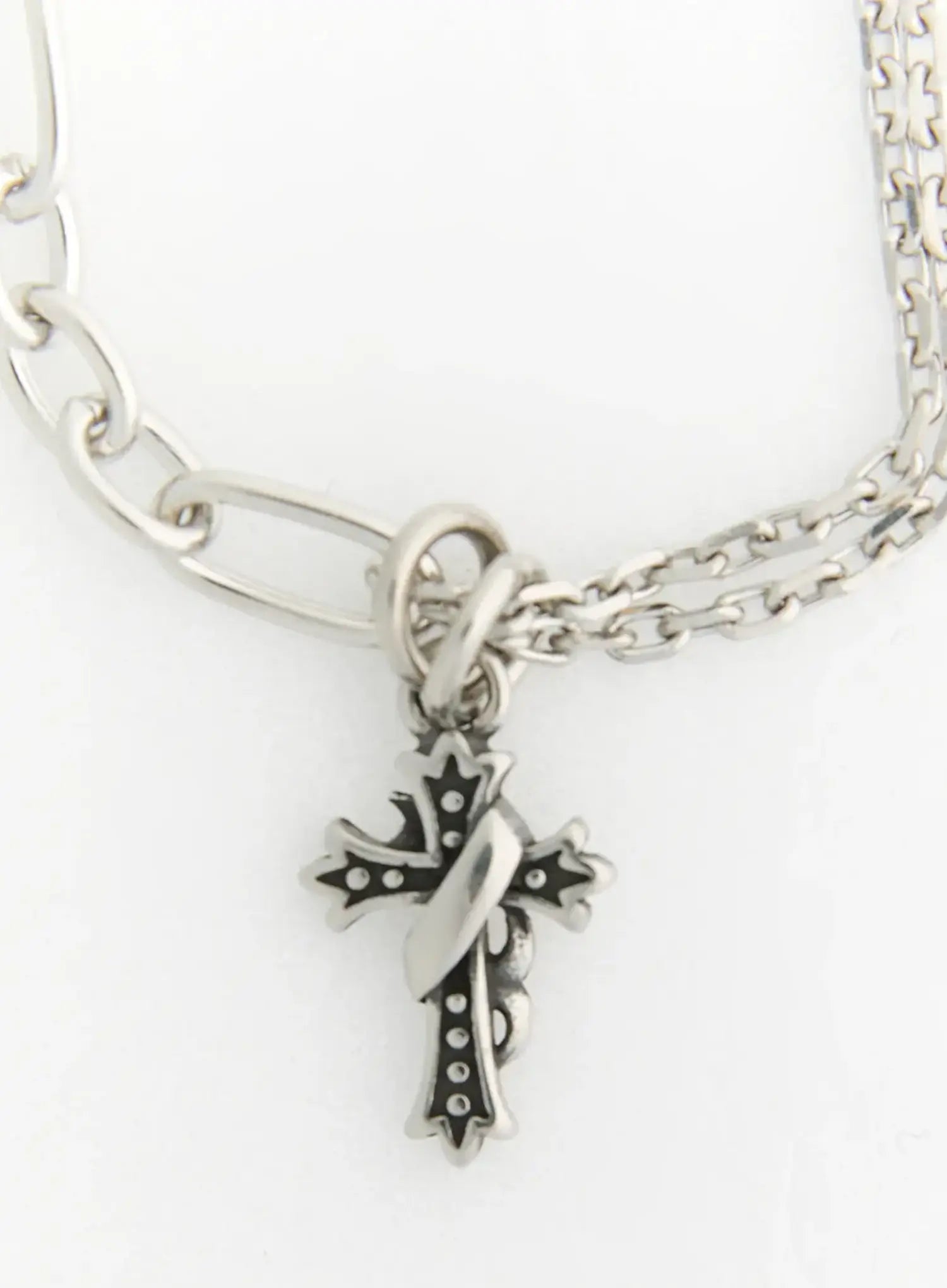 LEWKIN Ellis Cross Chain Necklace IL517 silver close-up detail of ornate gothic cross pendant with engraved dot pattern on mixed multi-strand chain
