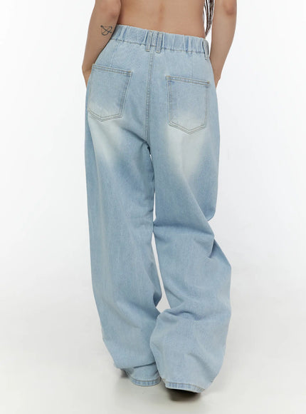 Elunie Washed Wide Leg Jeans CL507 light blue back view on model showing elastic waistband, dual back pockets, wide-leg fit, and hem pooling