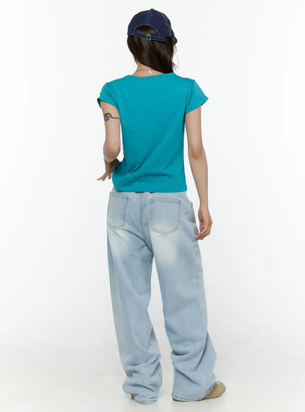 Elunie Washed Wide Leg Jeans CL507 light blue back full-length model shot styled with teal tee and navy cap showing overall back silhouette