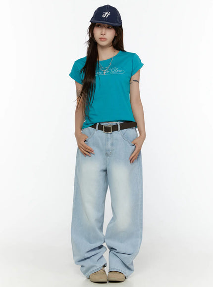 LEWKIN Elunie Washed Wide Leg Jeans CL507 light blue front full-length model shot styled with teal tee, navy cap, and brown belt