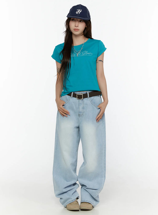LEWKIN Elunie Washed Wide Leg Jeans CL507 light blue front full-length model shot styled with teal tee, navy cap, and brown belt