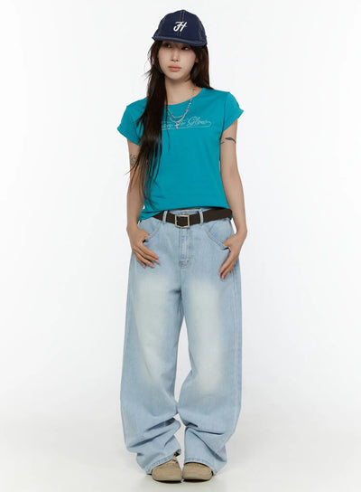 LEWKIN Elunie Washed Wide Leg Jeans CL507 light blue front full-length model shot styled with teal tee, navy cap, and brown belt