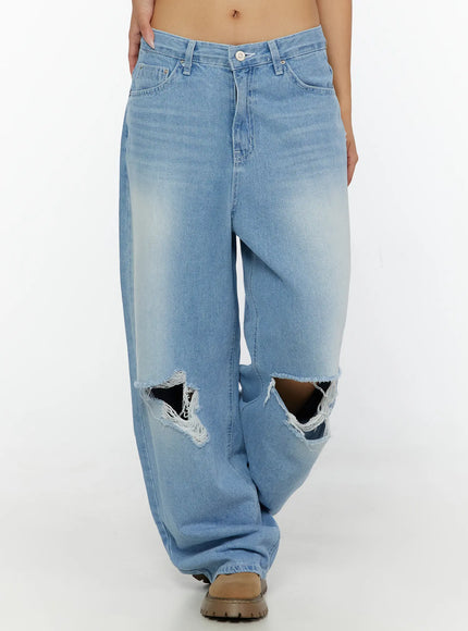 Elvin Low Rise Baggy Ripped Jeans CL515 Light blue front walking shot on model showing double large frayed knee rips low rise waist and wide leg fit