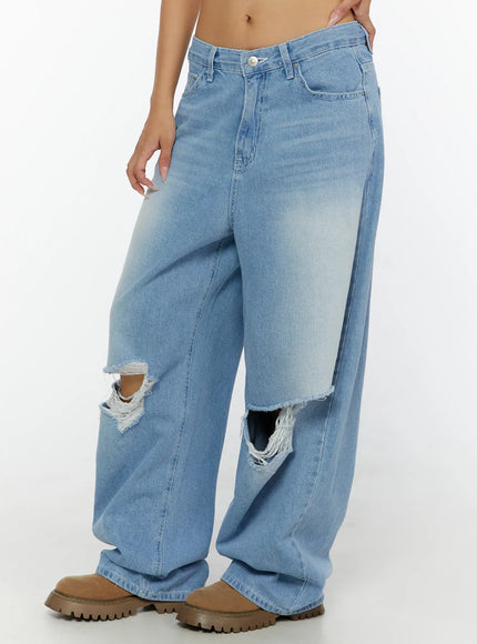 Elvin Low Rise Baggy Ripped Jeans CL515 Light blue side shot on model showing low rise fit wide leg drape double knee rips and faded wash detail
