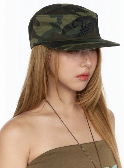 Embroidered Graphic Baseball Cap CL528 Camouflage side angled view on model showing large black W embroidery on front panel cap brim pulled down over face