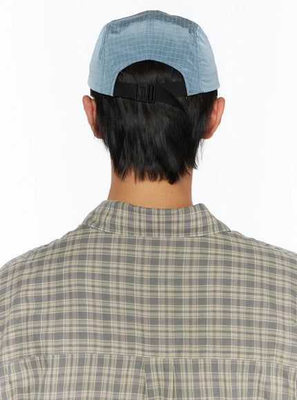 Embroidered Outdoor Cap IL520 Blue back model close-up showing ripstop nylon crown panels and black webbing buckle closure strap