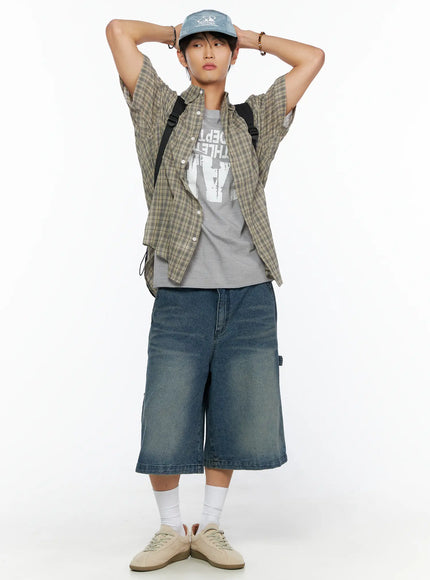 Embroidered Outdoor Cap IL520 Blue full-body model shot hands raised behind head wearing cap styled with plaid shirt denim shorts backpack