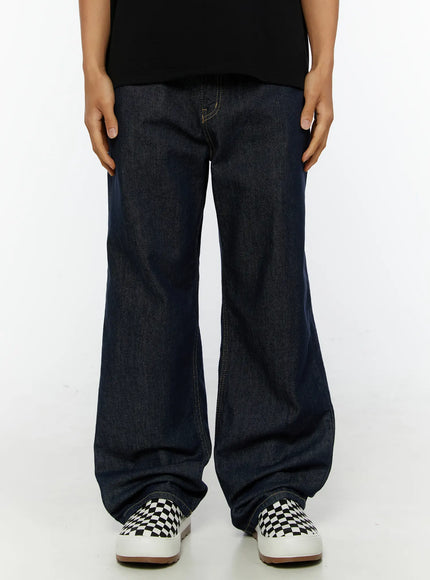 Emil Dark-Wash Straight-Leg Jeans IL515 Dark blue front close-up on model without cuff showing wide straight-leg raw denim silhouette with checkerboard sneakers