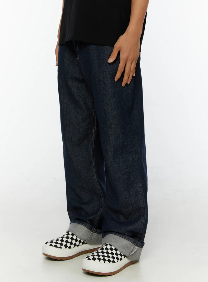 Emil Dark-Wash Straight-Leg Jeans IL515 Dark blue side shot on model hand in pocket showing wide-leg denim with rolled cuff and loafer styling