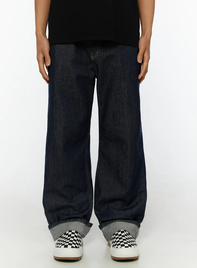 LEWKIN Emil Dark-Wash Straight-Leg Jeans IL515 Dark blue front close-up on model cropped at waist showing wide-leg silhouette with rolled cuff hem XS