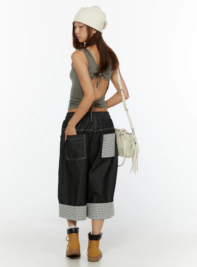 LEWKIN Esmé Gingham Cuff Jean Shorts CL515 Black side-rear view on model wearing beanie and tan boots with crossbody bag