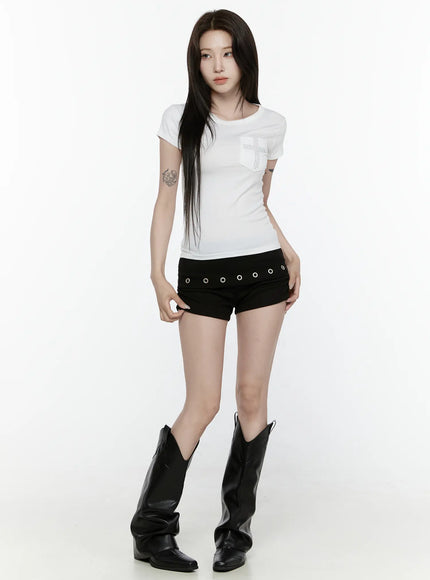 Eyelet Detail Mini Shorts IL522 Black full-body front shot on model in white rhinestone cross tee and cowboy boots, standing straight facing camera