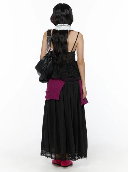 Eyelet Lace Flared Long Skirt CL510 Black back model shot styled with dotted cami, lace choker, magenta knit tied at waist, and black shoulder bag