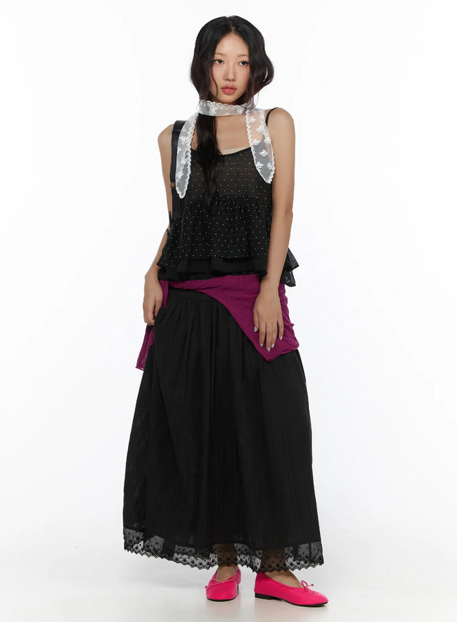 Eyelet Lace Flared Long Skirt CL510 Black full-length front model shot styled with lace scarf, dotted top, and magenta knit tied at waist with pink flats
