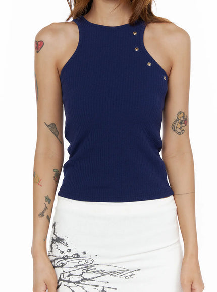 Eyelet Ribbed Tank Top CL503 Dark blue close-up front detail on model, highlighting ribbed knit fabric, racerback neckline, and diagonal row of gold eyelets on chest