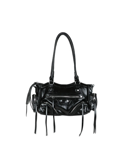 Faux Leather Shoulder Bag CL527 Black hanger front view with single top handle, silver zipper pockets, silver studs, fringe tassels and glossy crinkled faux leather finish