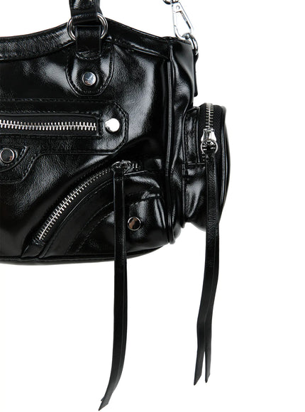Faux Leather Shoulder Bag CL527 Black close-up detail of side panel showing round zip pouch, silver studs, diagonal zipper and black leather fringe tassels