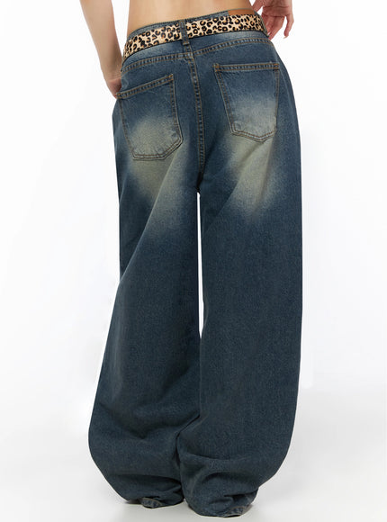 Fia Washed Baggy Jeans IL523 Dark blue back waist-to-hem shot on model showing dual back patch pockets, leopard belt with label tab, faded vintage wash denim