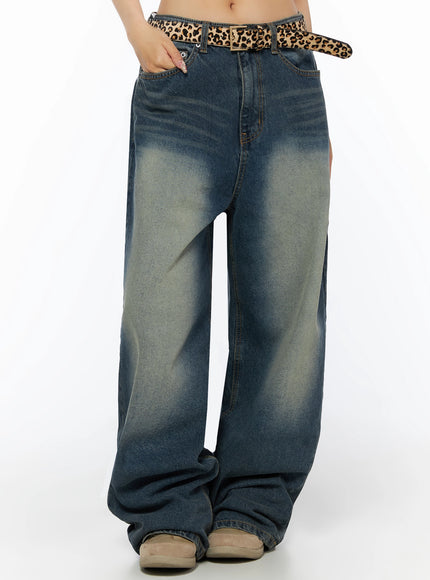 Fia Washed Baggy Jeans IL523 Dark blue front waist-to-hem shot on model with hand in pocket, leopard belt and faded vintage wash on wide-leg silhouette