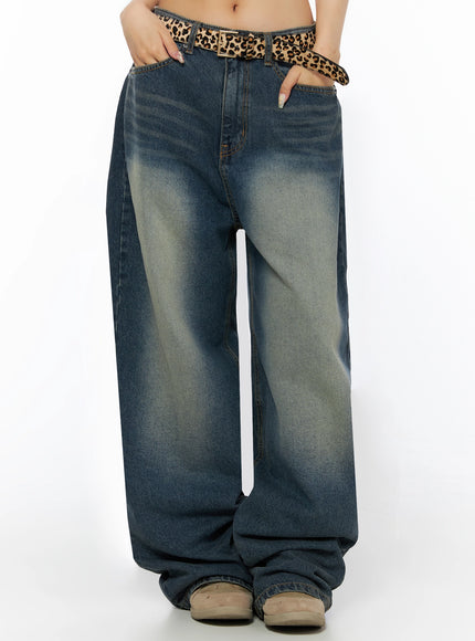 Fia Washed Baggy Jeans IL523 Dark blue front waist-to-hem shot on model with both hands in pockets, leopard belt, showing vintage faded wash and voluminous leg