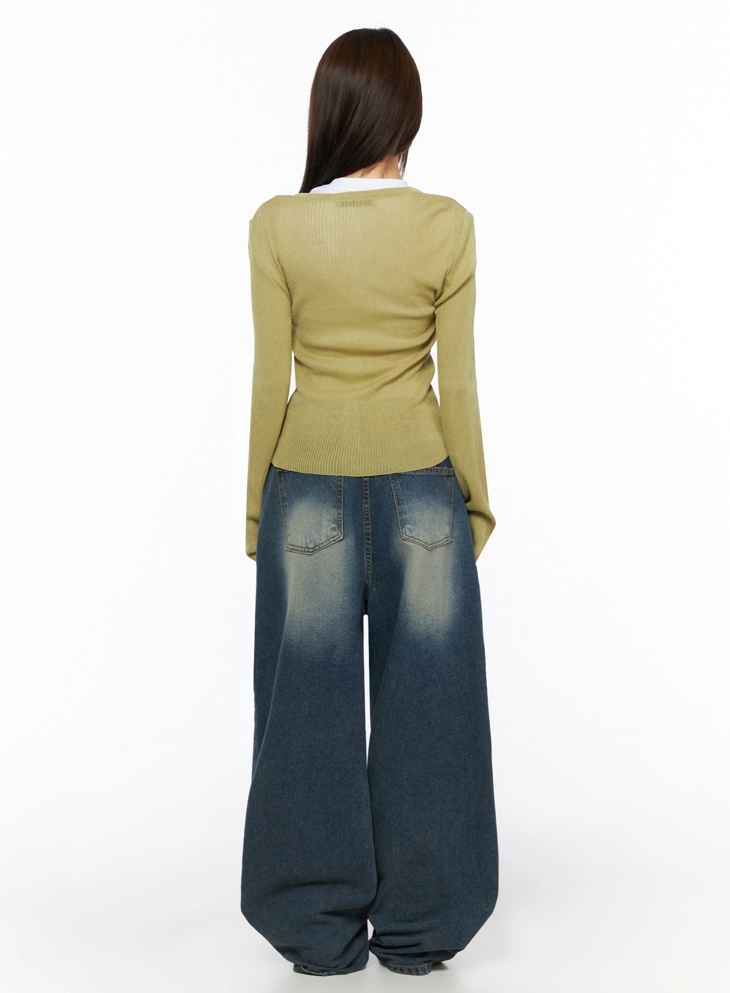 Fia Washed Baggy Jeans IL523 Dark blue full-body back shot on model in olive ribbed cardigan over white tee, showing back pockets and faded wide-leg hem pool