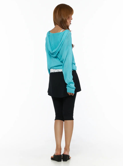 Flare Skort CL503 Black back full-length shot on model styled with teal hooded cardigan showing rear skirt drape and capri legging fit