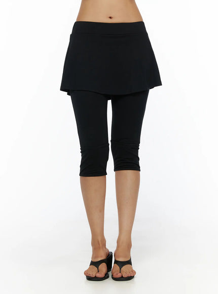 Flare Skort CL503 Black front close-up shot on model showing flared mini skirt overlay with wide waistband over cropped capri leggings