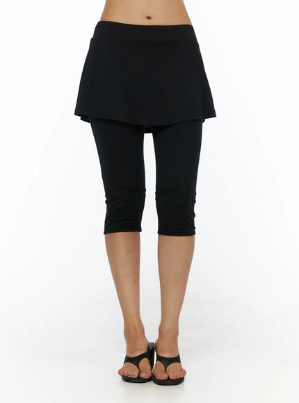 Flare Skort CL503 Black front shot on model showing full skort silhouette with flared mini skirt overlay cropped legging and black thong sandals