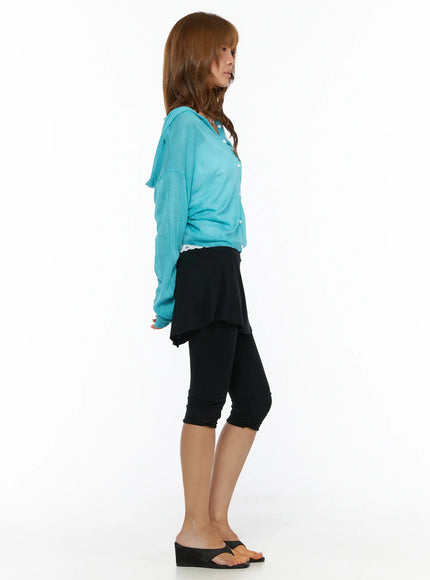 Flare Skort CL503 Black side full-length shot on model styled with teal cardigan showing skirt overlay silhouette and cropped legging length