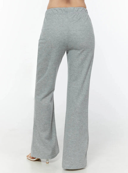Flare Sweatpants IU524 Gray back shot on model cropped at waist showing rear panel elastic waistband and wide flared hem