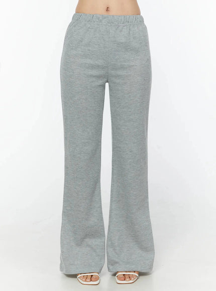 LEWKIN Flare Sweatpants IU524 Gray front shot on model cropped at waist showing elastic waistband and flared leg silhouette with heeled sandals