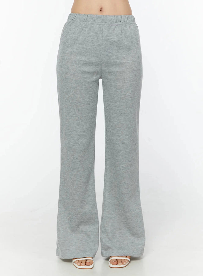 LEWKIN Flare Sweatpants IU524 Gray front shot on model cropped at waist showing elastic waistband and flared leg silhouette with heeled sandals