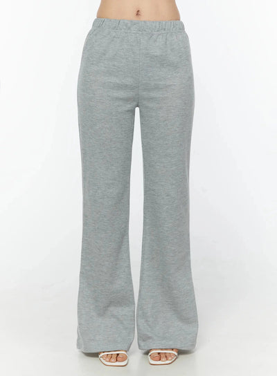 LEWKIN Flare Sweatpants IU524 Gray front shot on model cropped at waist showing elastic waistband and flared leg silhouette with heeled sandals