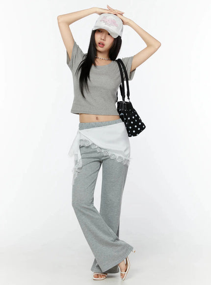 Flare Sweatpants IU524 Gray full-body front shot on model styled with lace mini skirt overlay cap and polka dot bag