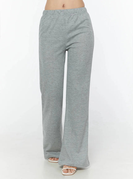 Flare Sweatpants IU524 Gray front shot on model cropped at mid-thigh showing elastic waist center seam and flare hem with sandals