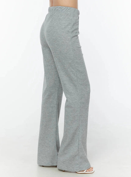 Flare Sweatpants IU524 Gray side shot on model cropped at waist showing side seam flare silhouette and elastic waistband detail