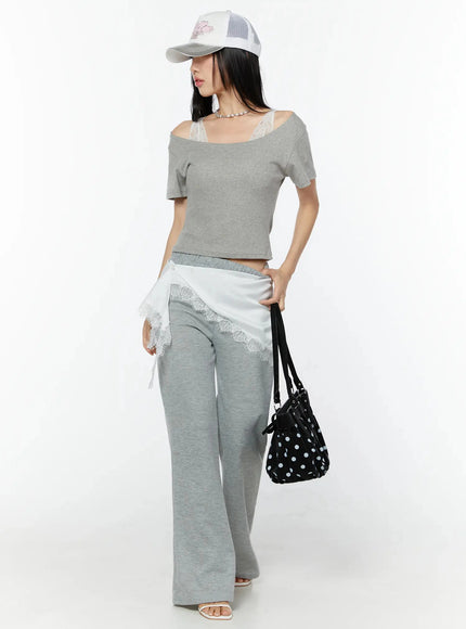 Flare Sweatpants IU524 Gray full-body front shot on model styled with white lace skirt overlay cap and polka dot bag side pose