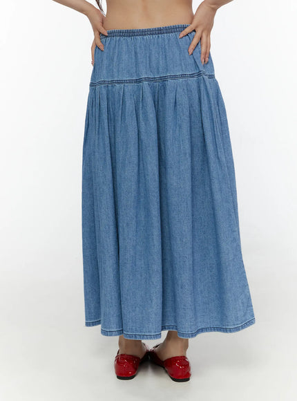 Flared Denim Maxi Skirt CL508 Blue front close-up on model showing elastic waistband, yoke seam and pleated maxi length
