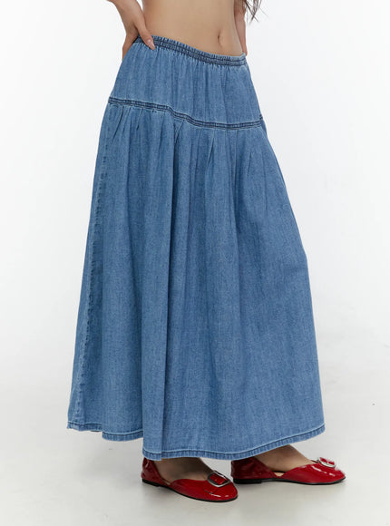Flared Denim Maxi Skirt CL508 Blue side shot on model showing elastic waist, pleated panel seam and full A-line silhouette
