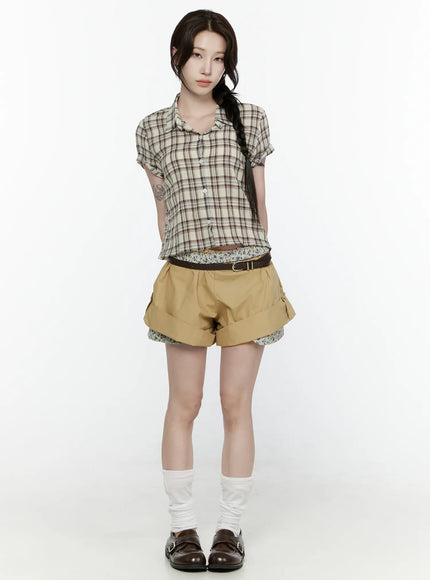 Floral Banded Shorts IL521 Beige full-length front shot on model styled with plaid crop top, brown belt, and loafers standing straight