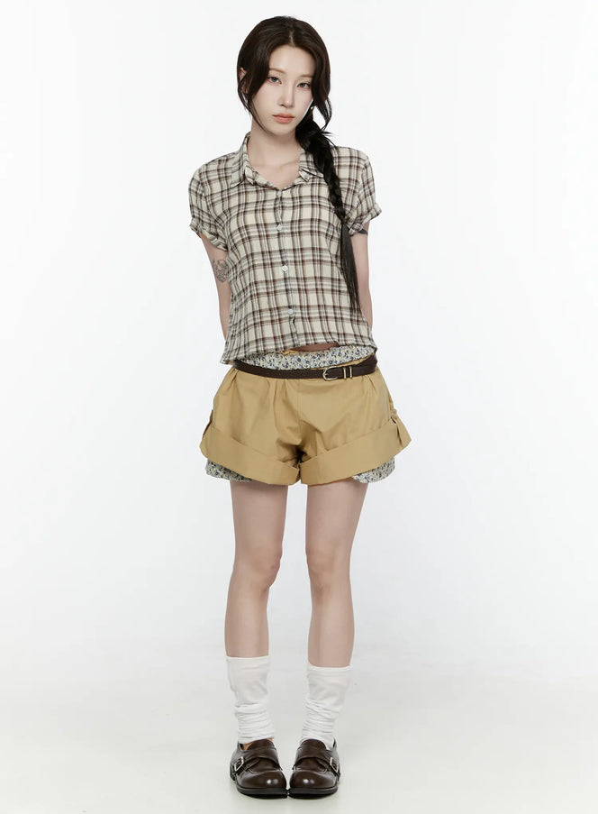 Floral Banded Shorts IL521 Beige full-length front shot on model styled with plaid crop top, brown belt, and loafers standing straight