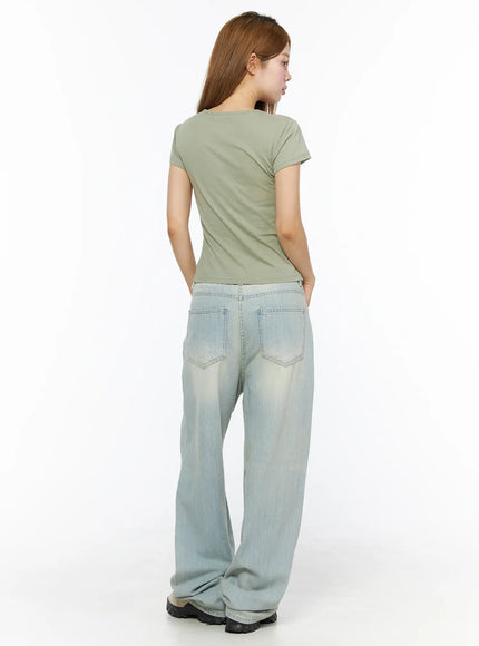Floral Graphic Tee CL501 dark green back shot on model showing plain back cropped hemline short sleeves crew neck with light wash wide-leg jeans