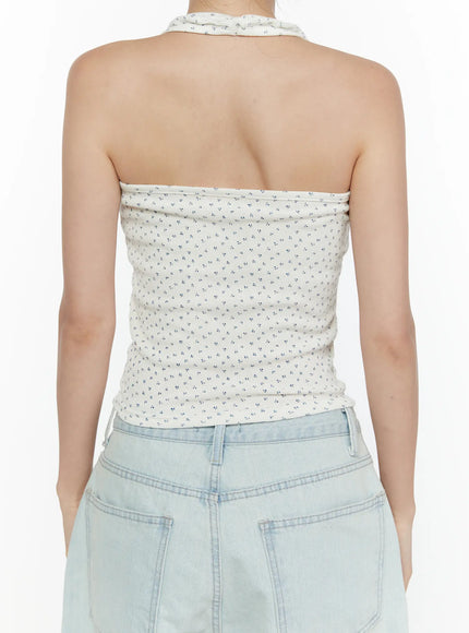 Floral Halter Top CL521 White back close-up on model, showing open back halter design, halter neck strap, and tiny blue floral ribbed fabric detail