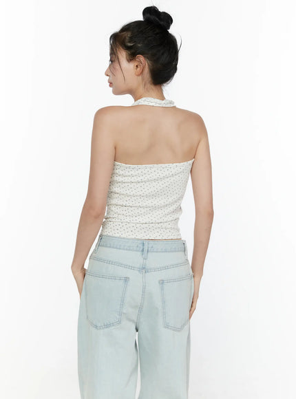 Floral Halter Top CL521 White back view on model with bun updo, showing open back halter neckline, floral ribbed crop, paired with light wash wide-leg jeans
