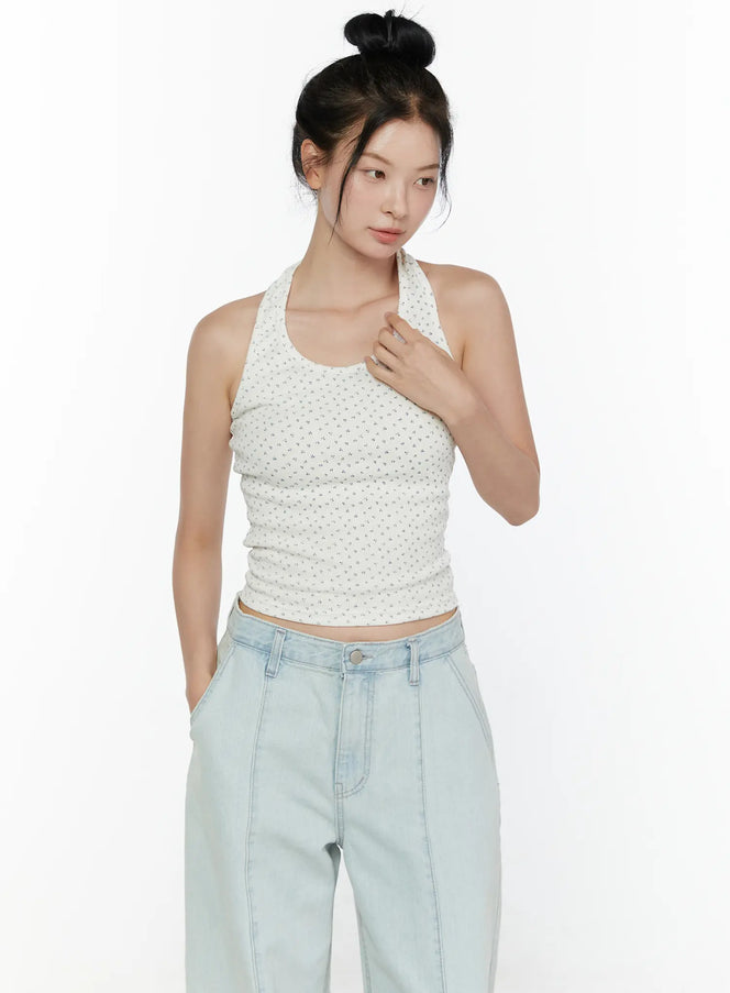 LEWKIN Floral Halter Top CL521 White S/M front view on model with bun updo, halter neckline, tiny floral ribbed crop top, styled with light wash wide-leg jeans