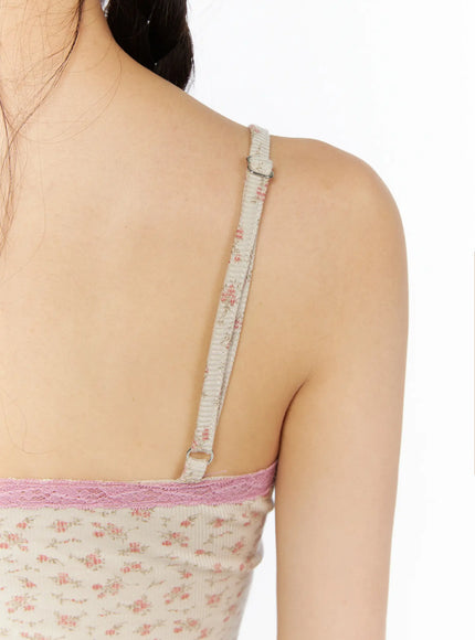Floral Lace Trim Cami CU530 Beige close-up back detail shot showing adjustable floral-print spaghetti strap with silver ring hardware and pink lace back hem trim