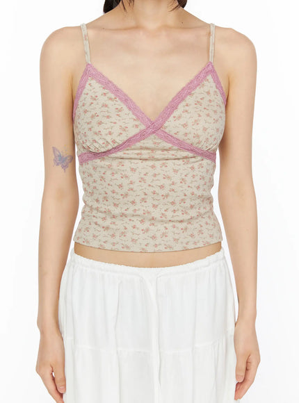 Floral Lace Trim Cami CU530 Beige detail front shot headless model showing pink lace cross trim V-neckline beige floral ribbed fabric and adjustable spaghetti straps