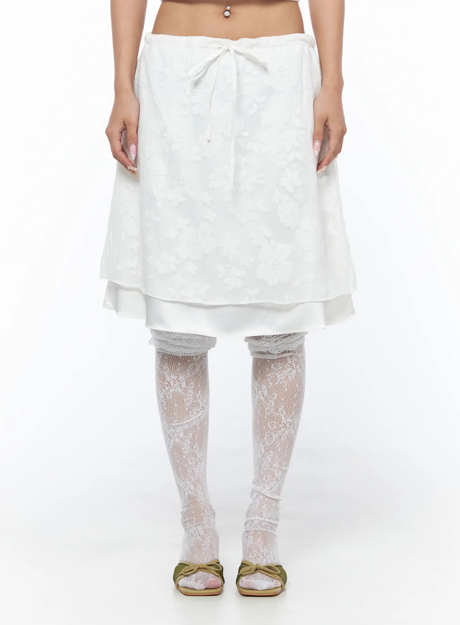 Floral Midi Skirt CU523 White front cropped shot on model showing bow tie waistband and floral jacquard upper layer over satin underlayer